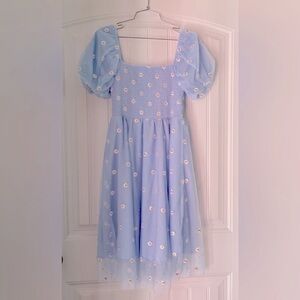 Adorable baby blue dress with white daisies. Worn for a few special occasions.